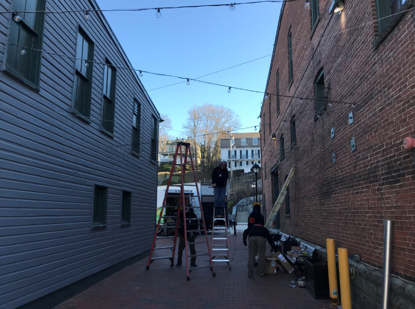string light installation between two buildings 